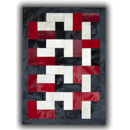 Tapis noir, blanc et rouge sur peau de vache patchwork Ceuta