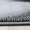 Tapis courbe moderne noir à courtes mèches Zilfa