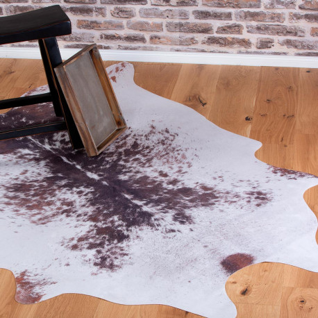 Tapis en peau de vache noir et blanc d'occasion - Décoration